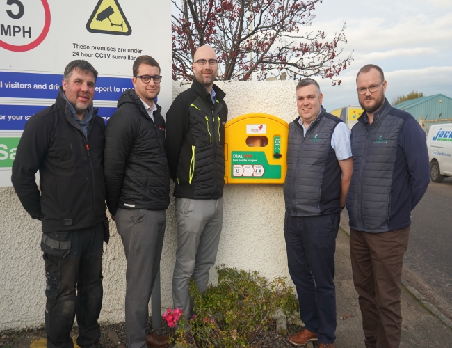 Capstone Construction Delivers New Community Defibrillator with Support from Local Businesses